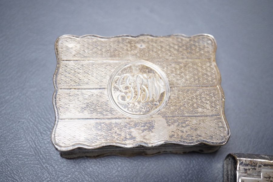 A Victorian silver ovoid snuff box, Henry William Dee, London, 1874, 58mm, together with two George V silver snuff boxes.